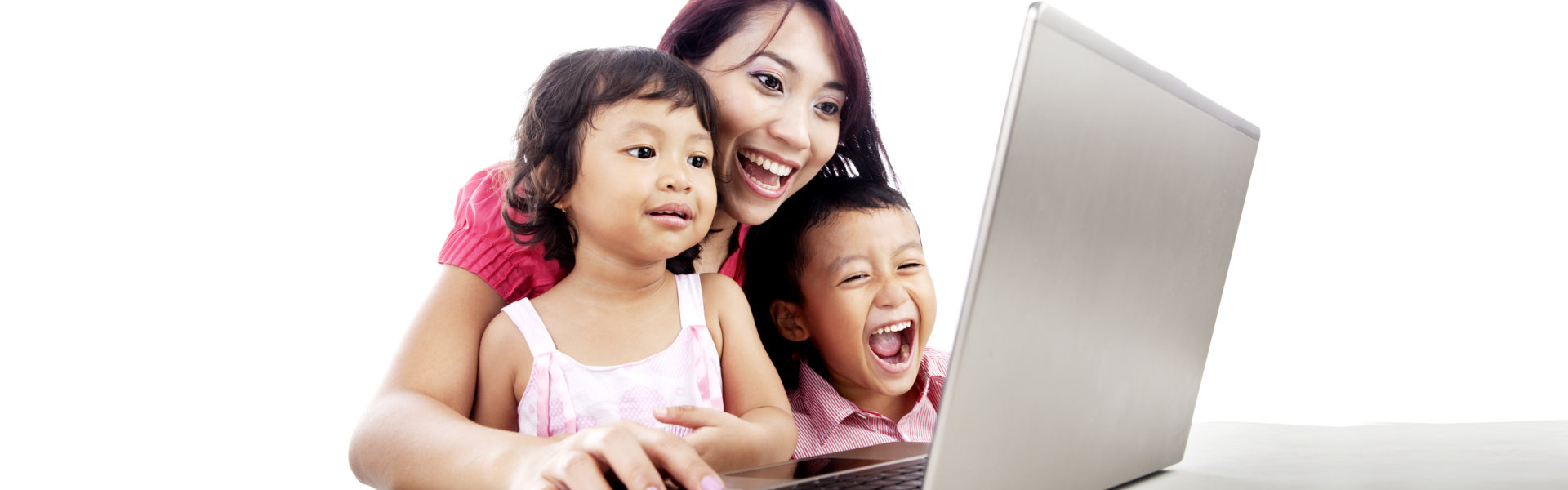 Happy young mother with her children using laptop computer