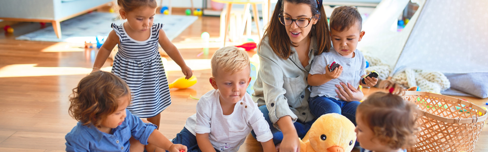 a teacher with kids surrounding her