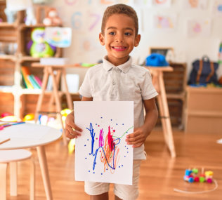boy showing his painting